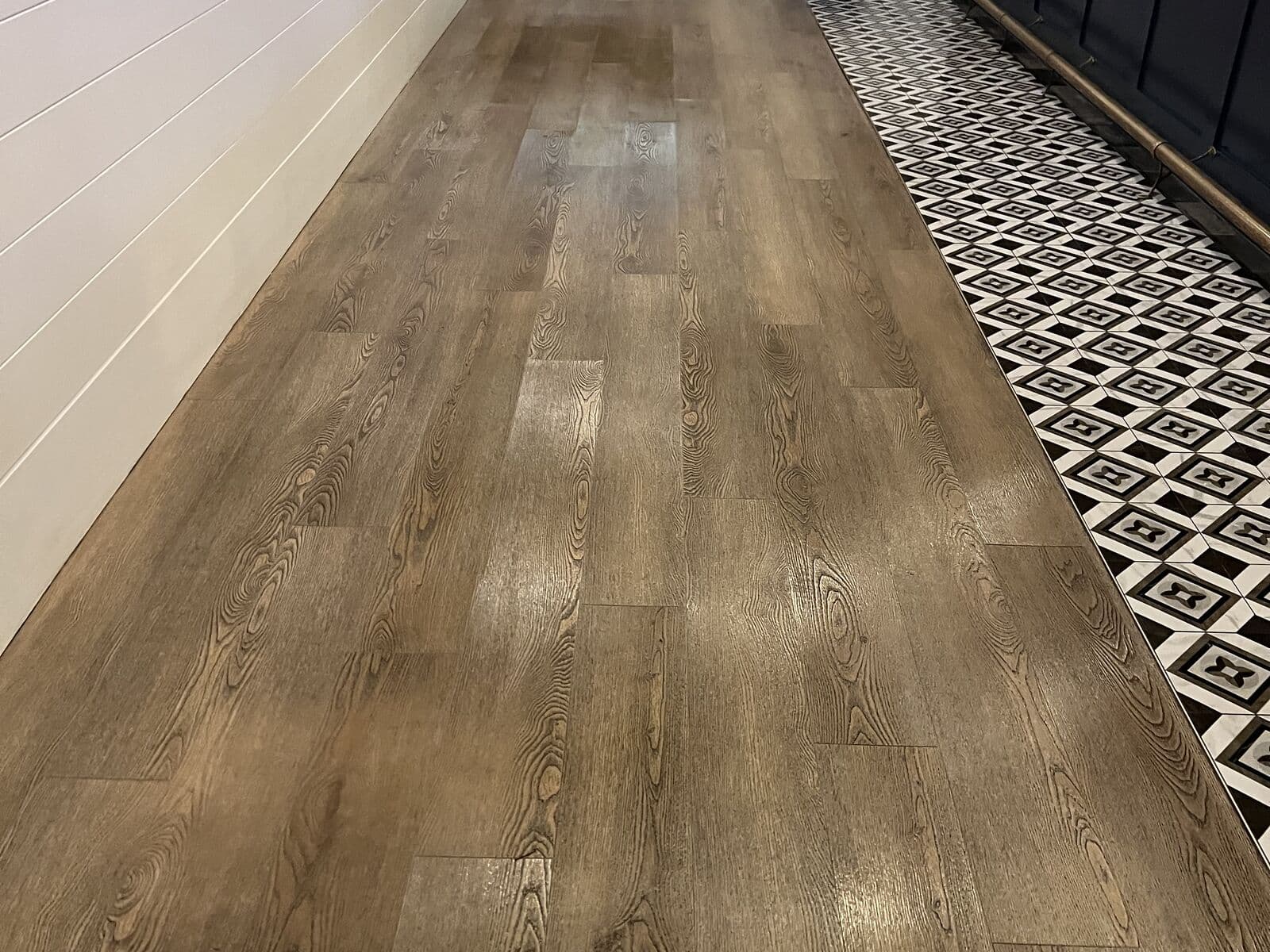 Clean vinyl plank walkway beside the bar at a Delta brewery