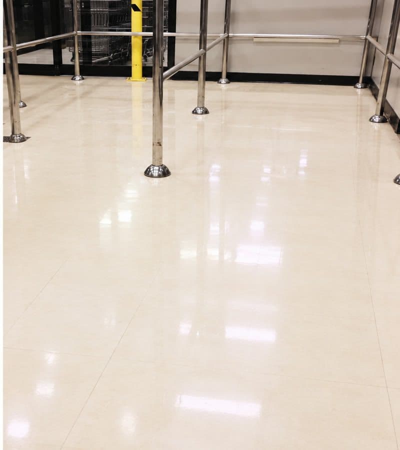 Glossy vinyl tile floor at a store entrance