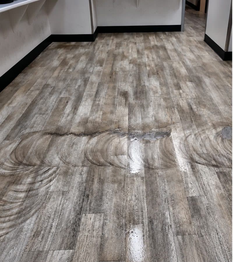 Vinyl plank office floor being scrubbed